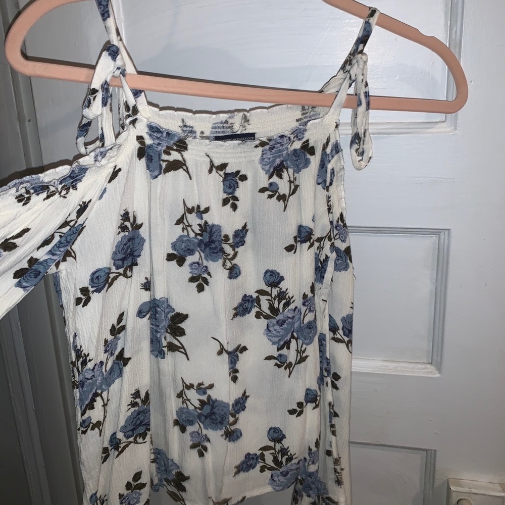 white blouse with blue flowers